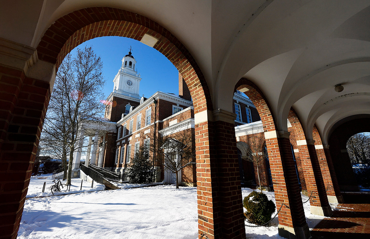 Gilman Hall in the snow viewed from one of its adjoining brick colonnades-Will Kirk 18