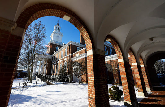 Gilman Hall in the snow viewed from one of its adjoining brick colonnades-Will Kirk 18